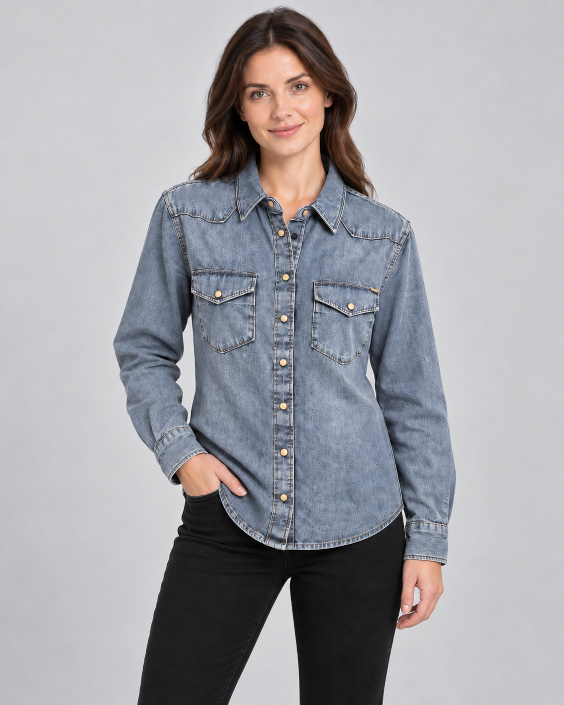 Female model wearing Pepe Jeans washed blue denim shirt jacket in a relaxed pose against a light grey studio background