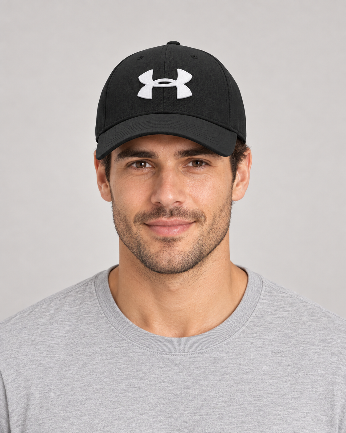 Under Armour Baseball Cap in Black on a studio model