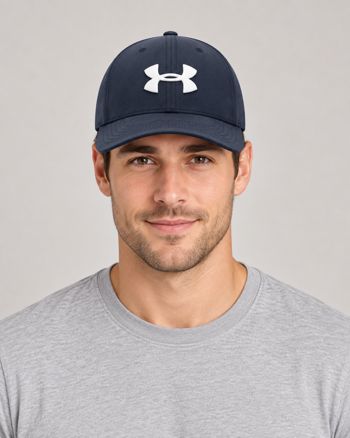 Under Armour Baseball Cap in Navy on a studio model