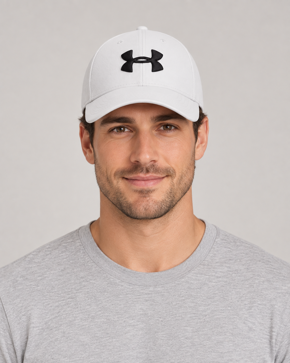 Under Armour Baseball Cap in White on a studio model