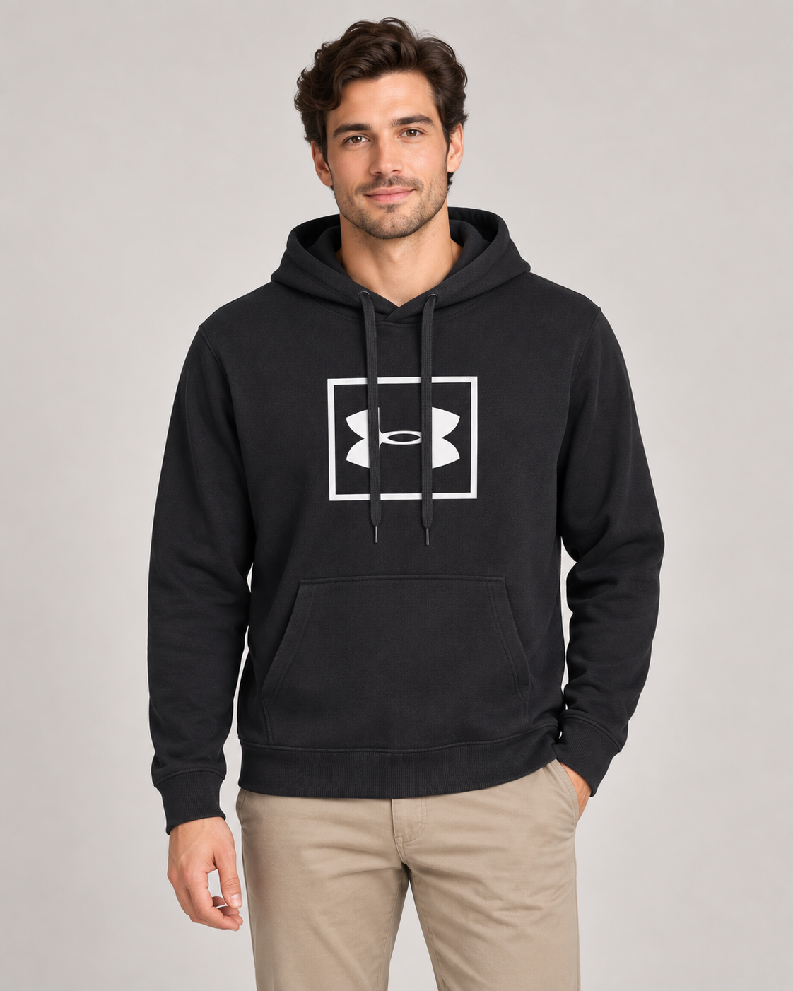 Under Armour Box Logo Hoodie in Black on a studio model