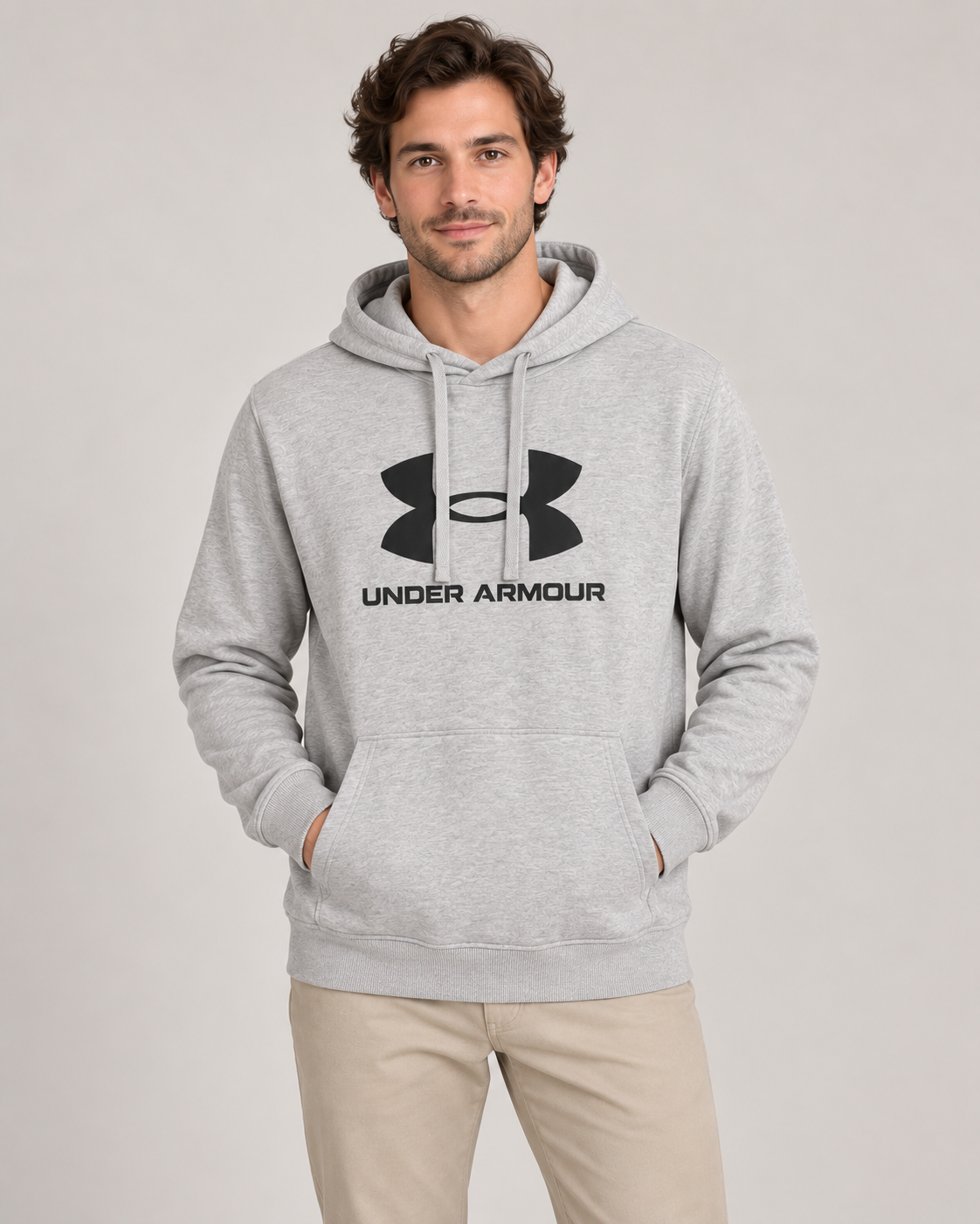 Under Armour Written Logo Hoodie in Grey on a studio model