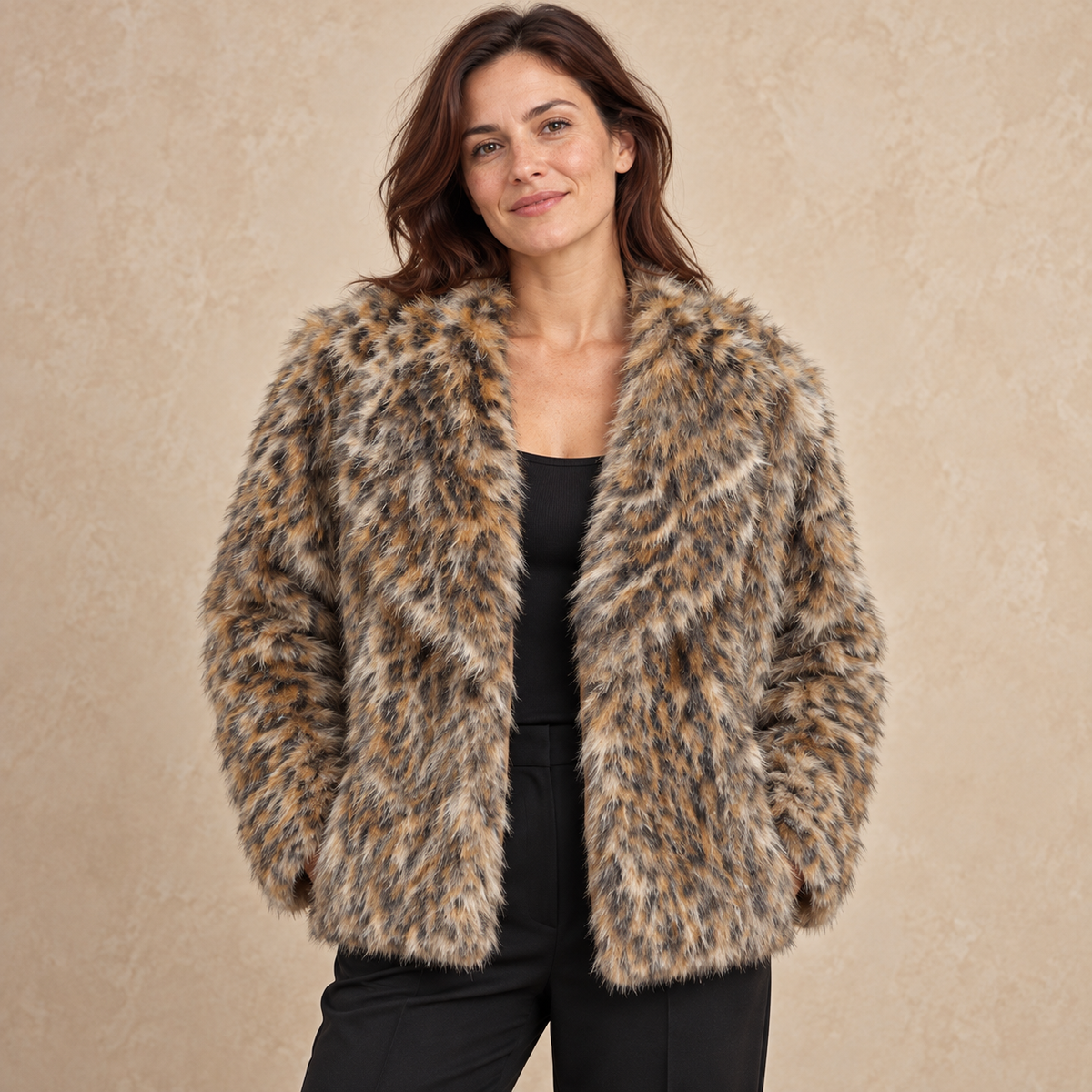Model wearing animal print shaggy textured jacket against a warm neutral background