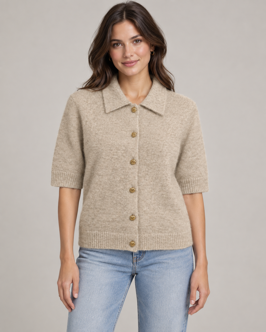 Woman wearing beige gold button collared knit cardigan