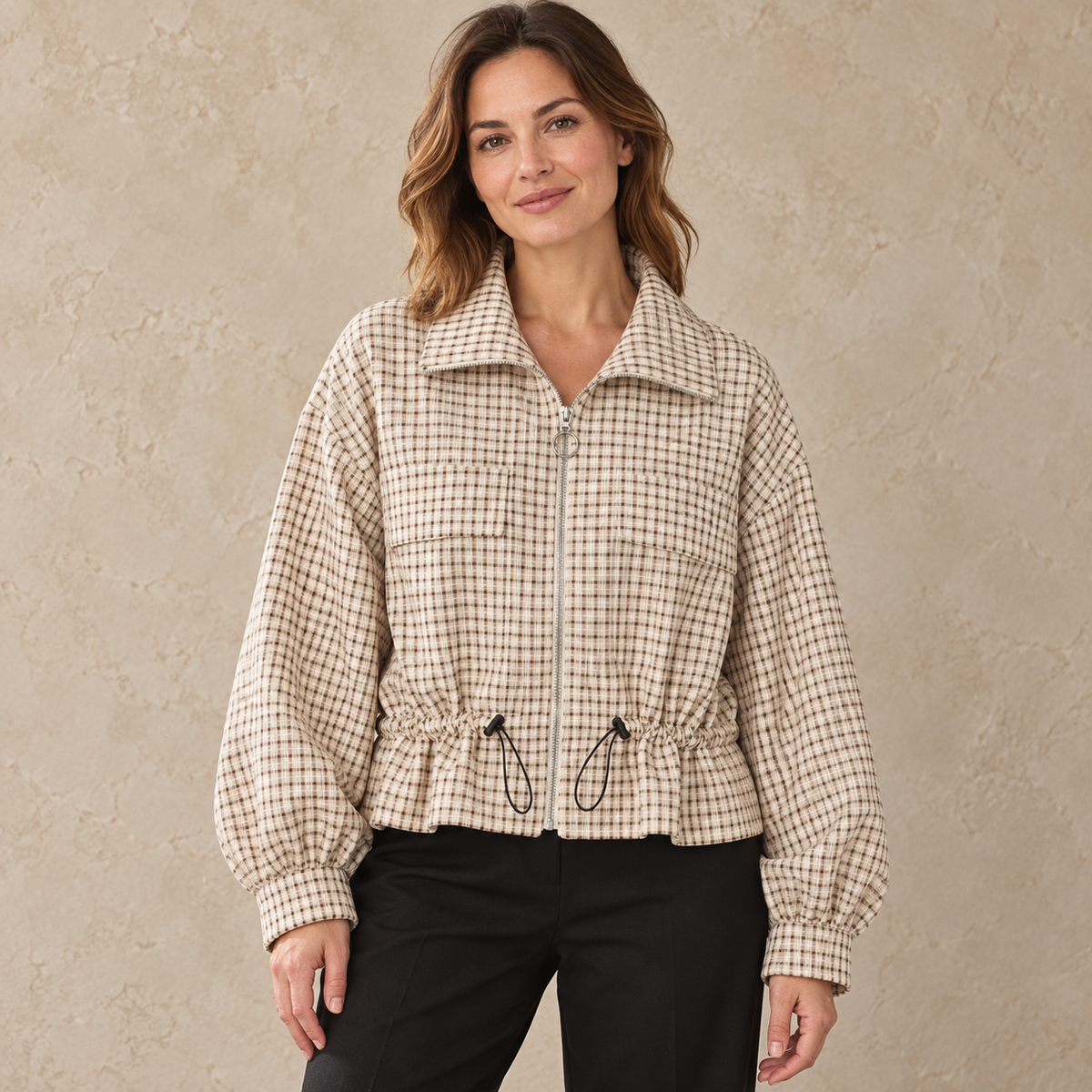 Model wearing cream checked drawcord zip jacket