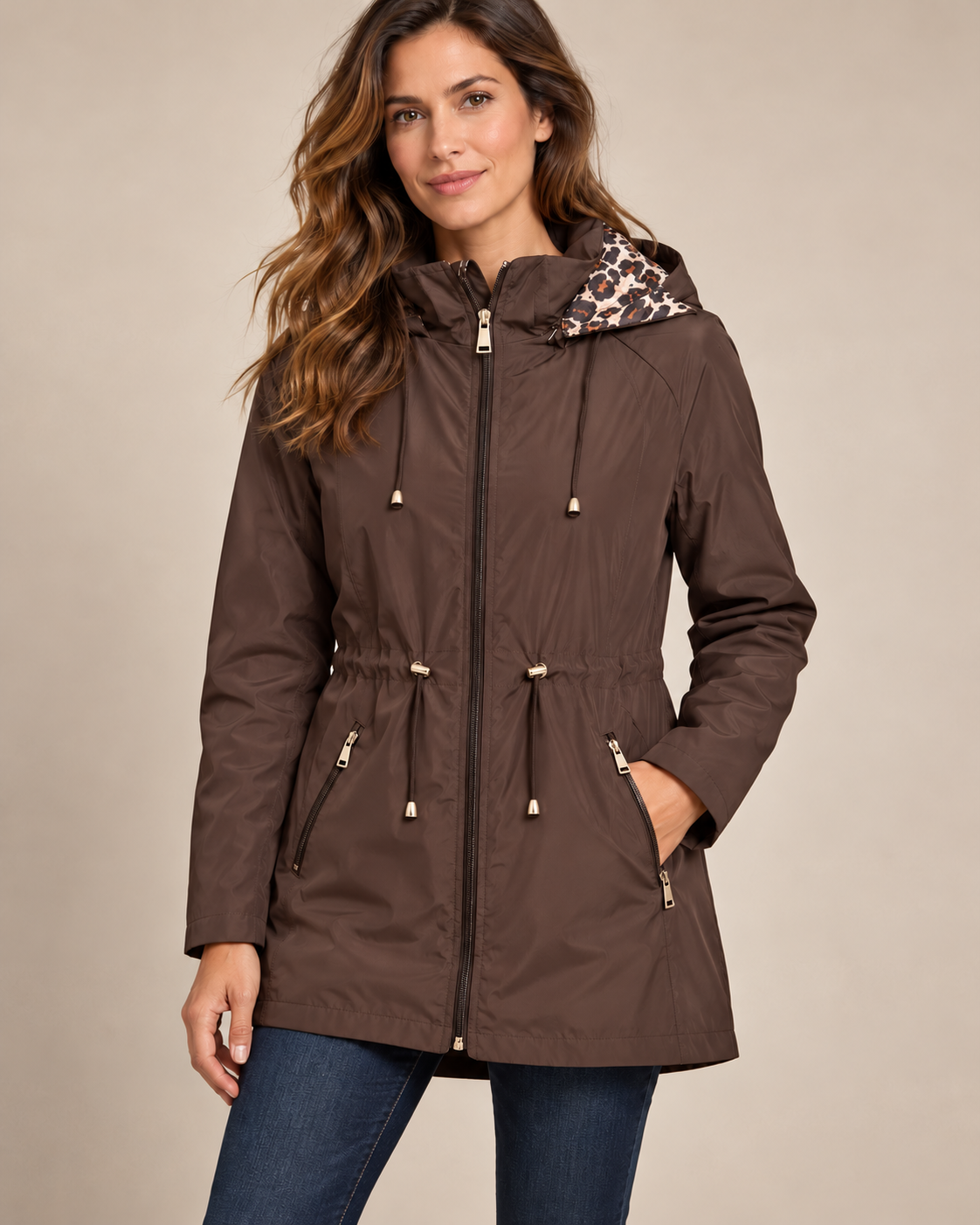 Chocolate waterproof leopard-lined hooded coat worn by a model