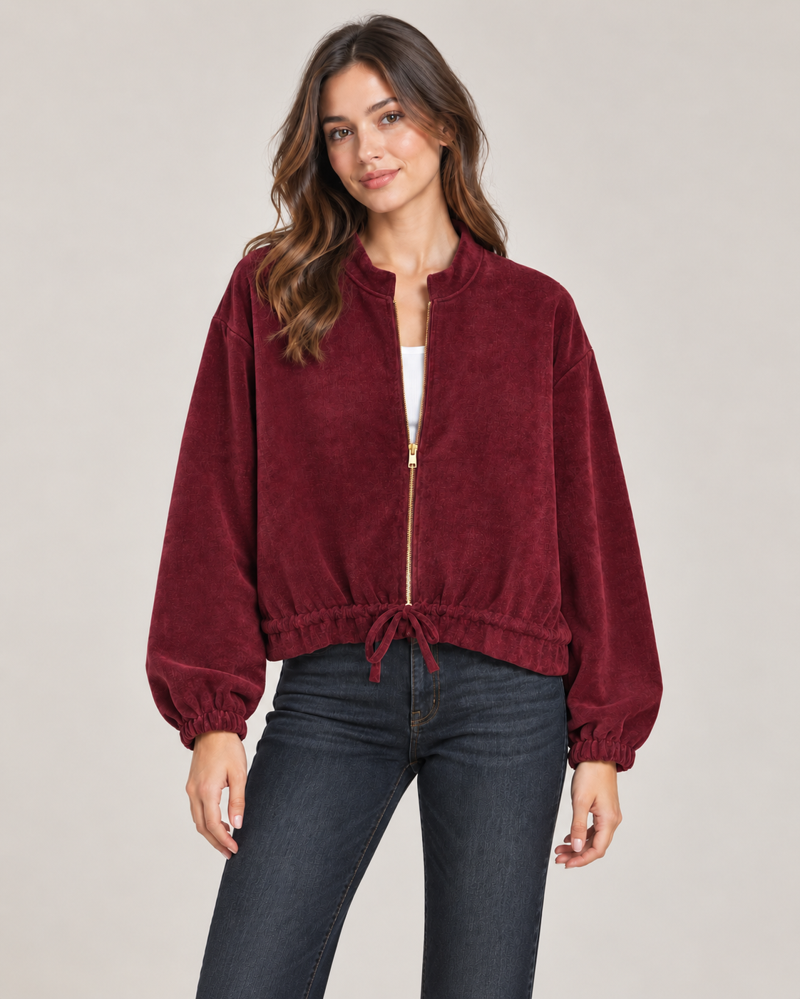 burgundy drawstring hem jacket on a female studio model