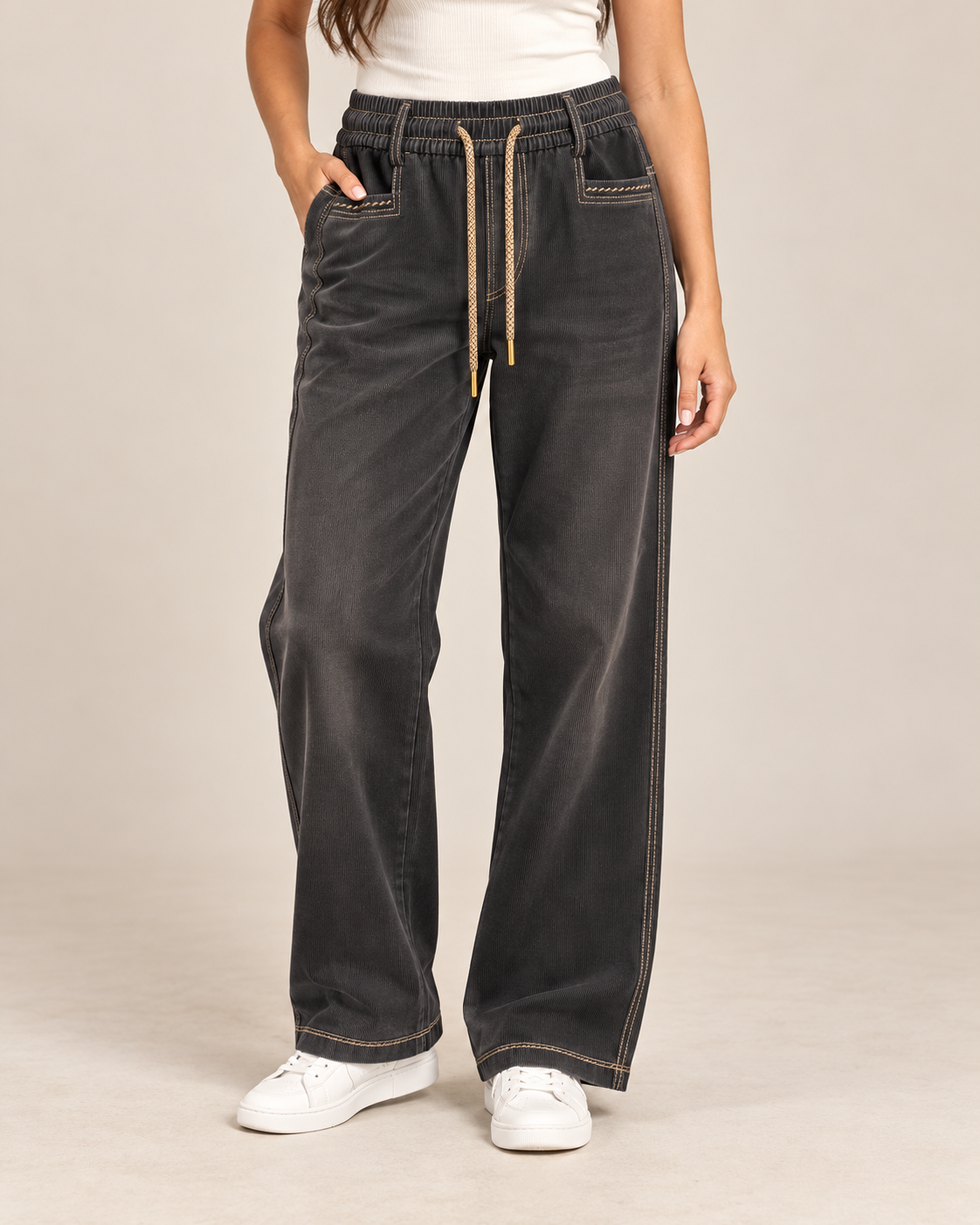 Black fine cord drawstring trousers worn by a model