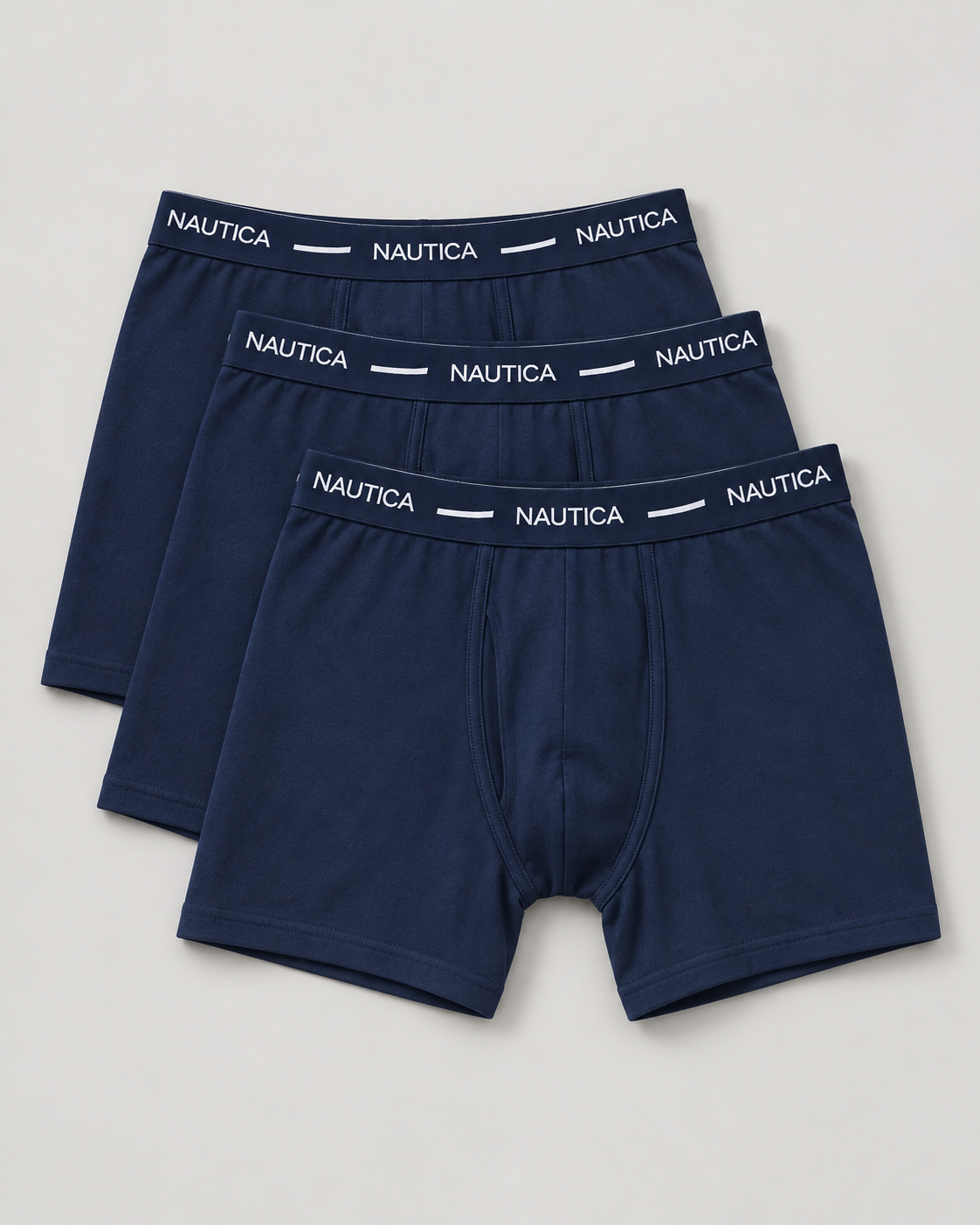 Three pairs of navy Nautica boxer briefs on a light studio background