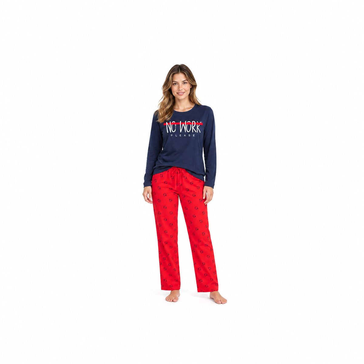 Model wearing a navy slogan top and red smiley-print full-length pyjama trousers