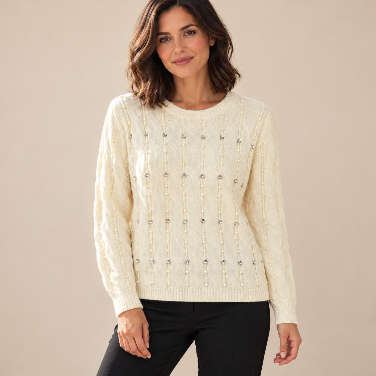 Cream embellished cable knit jumper on model