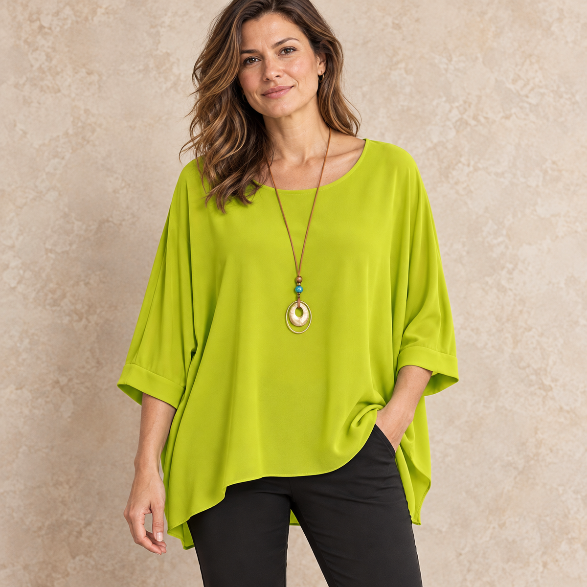 Model wearing lime relaxed batwing top