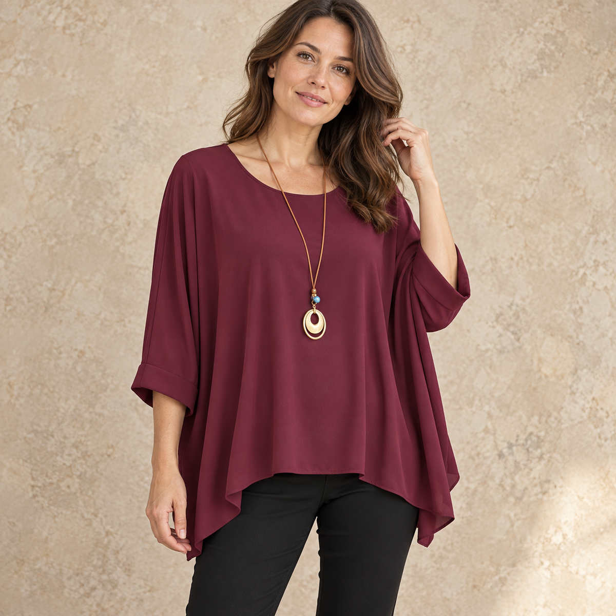 Model wearing wine relaxed batwing top