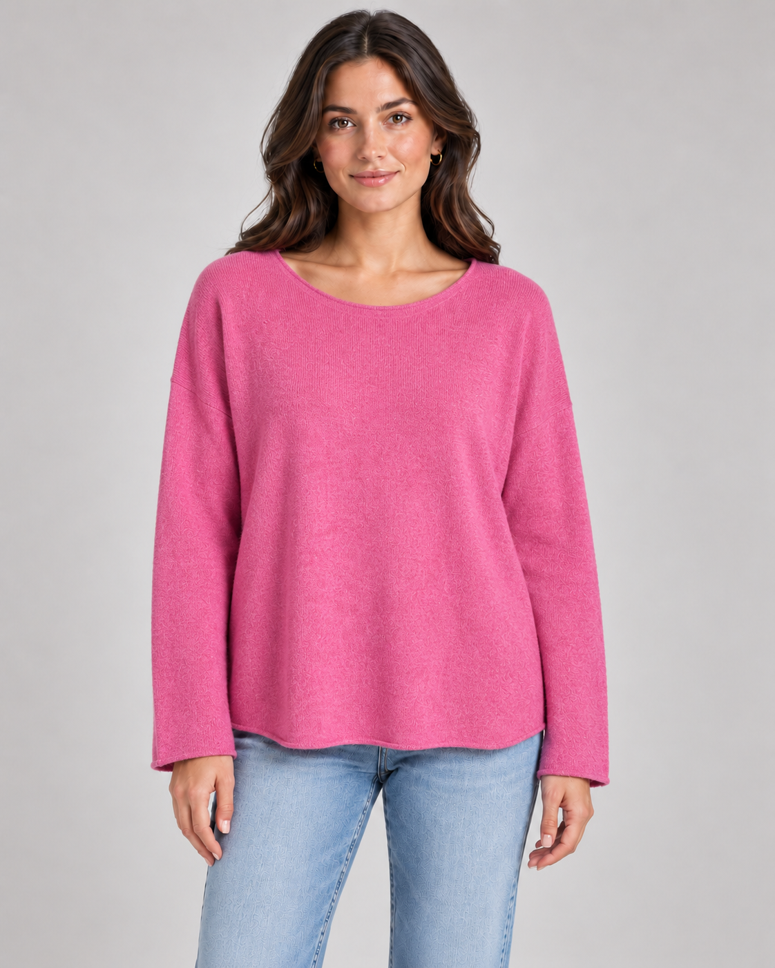 Women's round neck fine knit top in Rose Pink on a female studio model