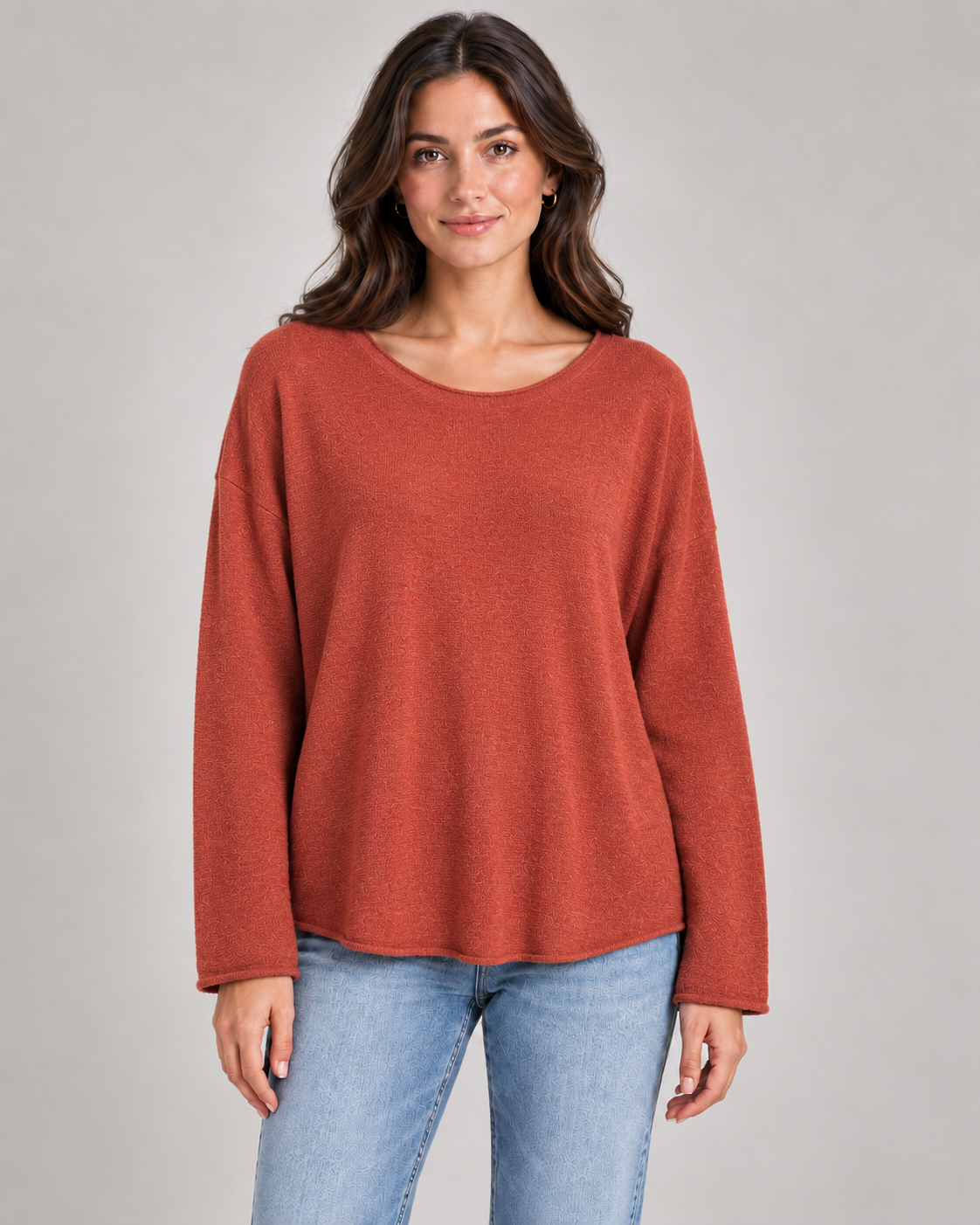 Women's round neck fine knit top in Rust on a female studio model