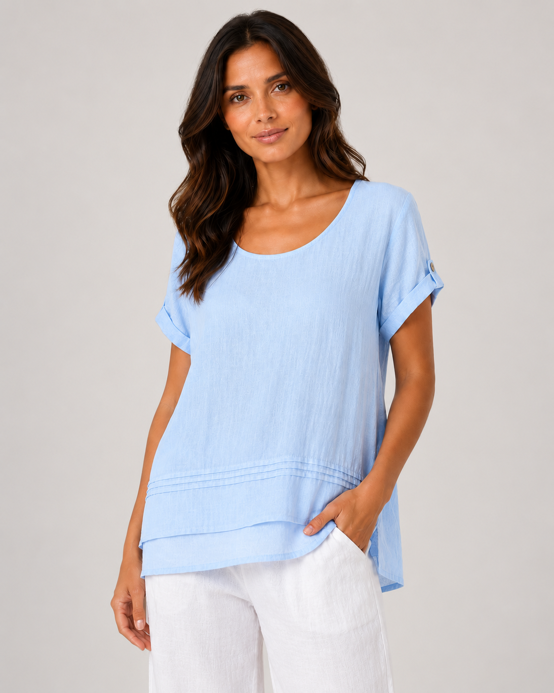 Light blue short sleeve tunic on a female studio model