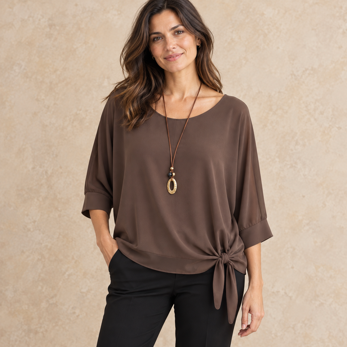 Model wearing chocolate side-tie draped blouse