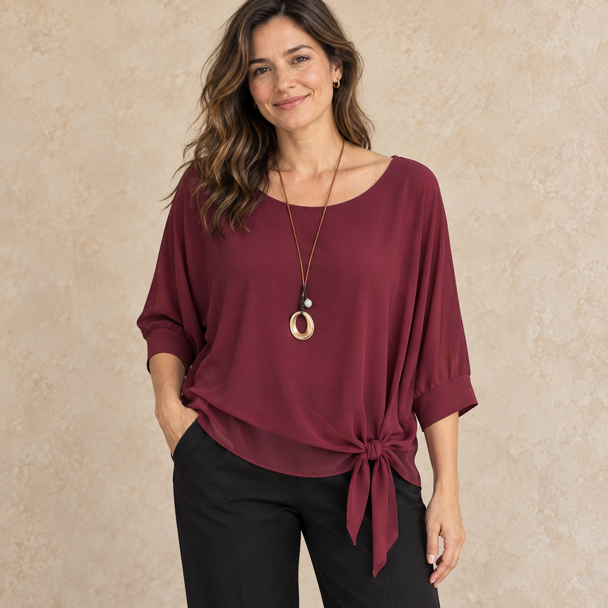 Model wearing wine side-tie draped blouse