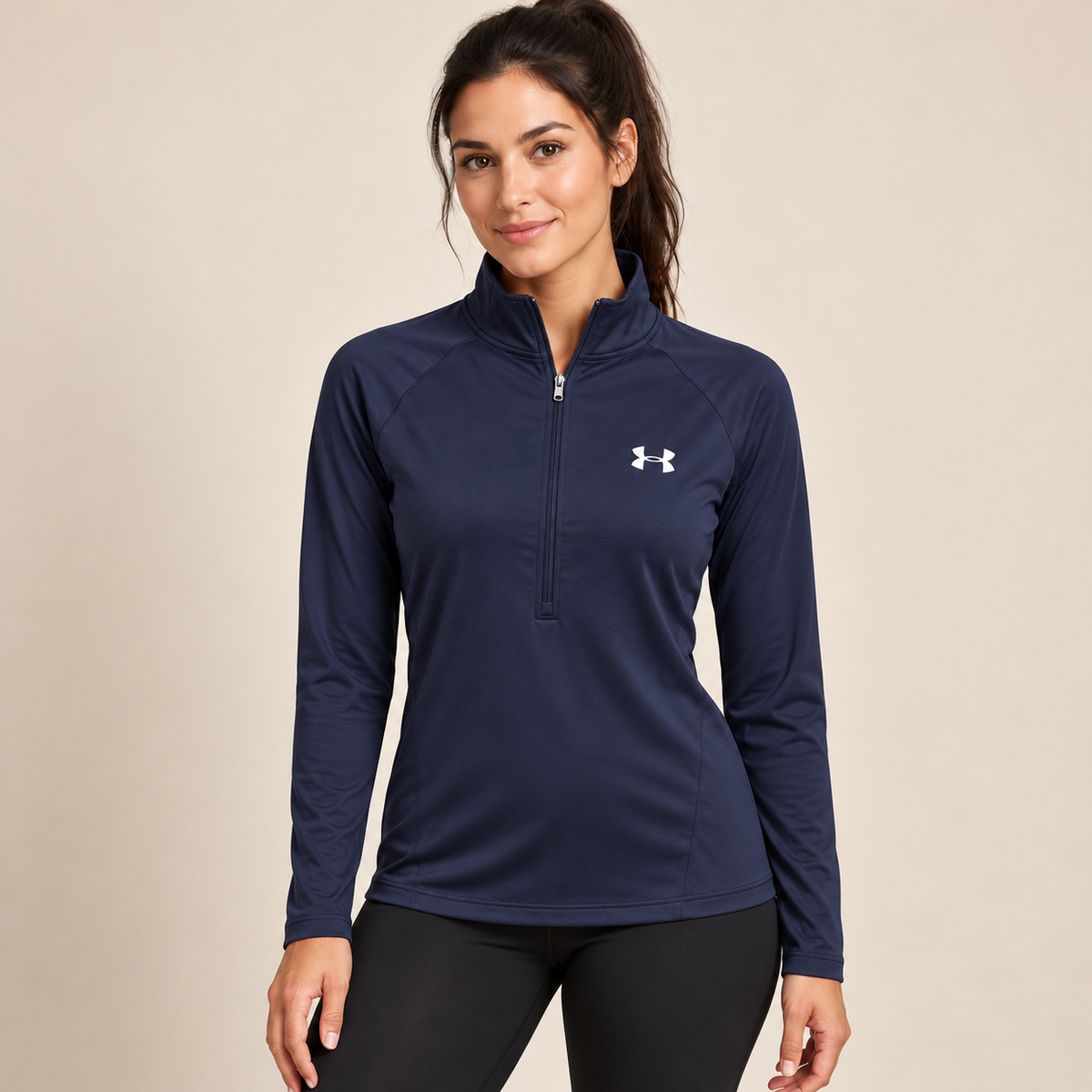 Female model wearing navy Under Armour zip-neck top
