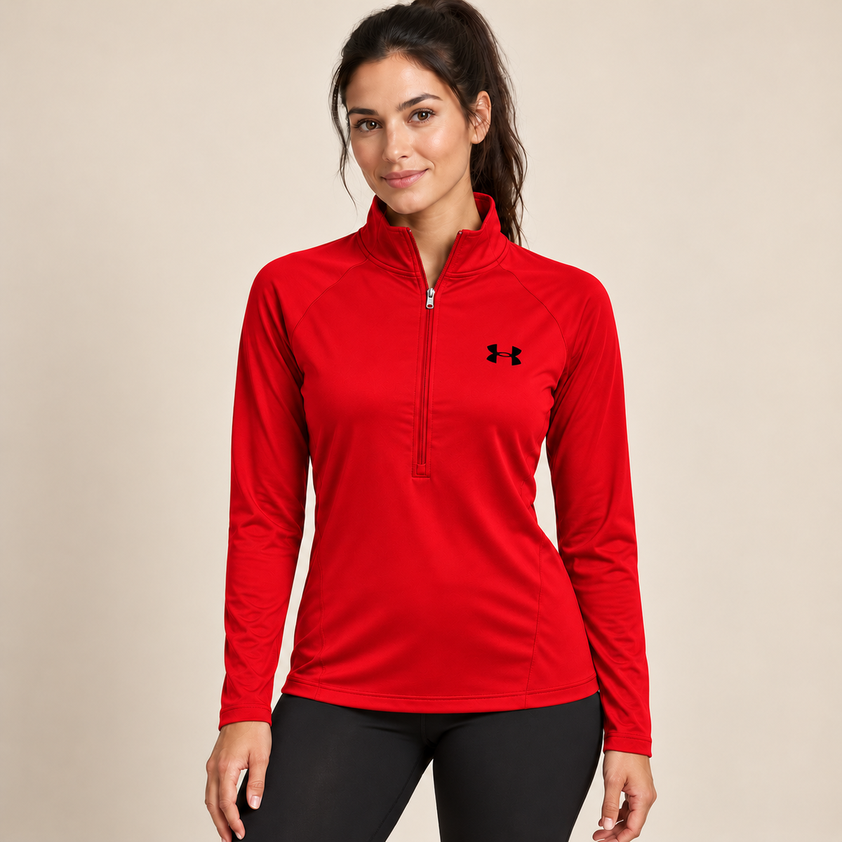Female model wearing red Under Armour zip-neck top