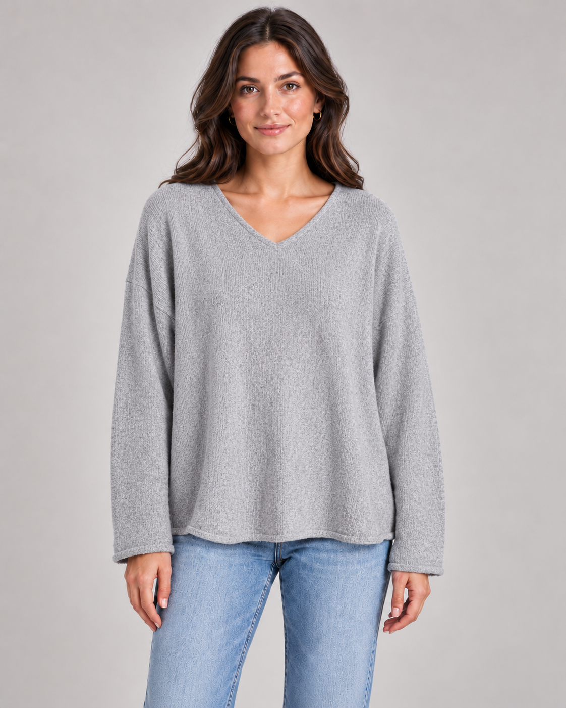Women's V-neck fine knit top in grey on a female studio model