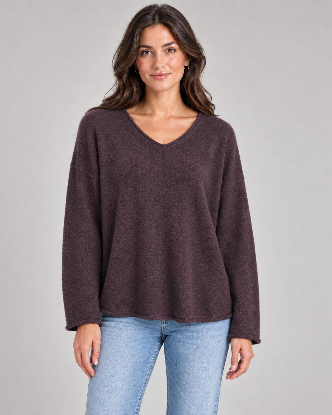 Women's V-neck fine knit top in plum on a female studio model