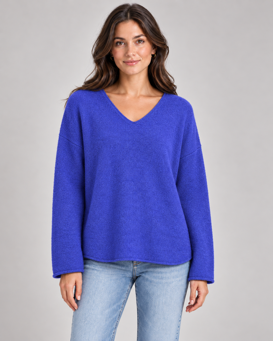 Women's V-neck fine knit top in royal blue on a female studio model